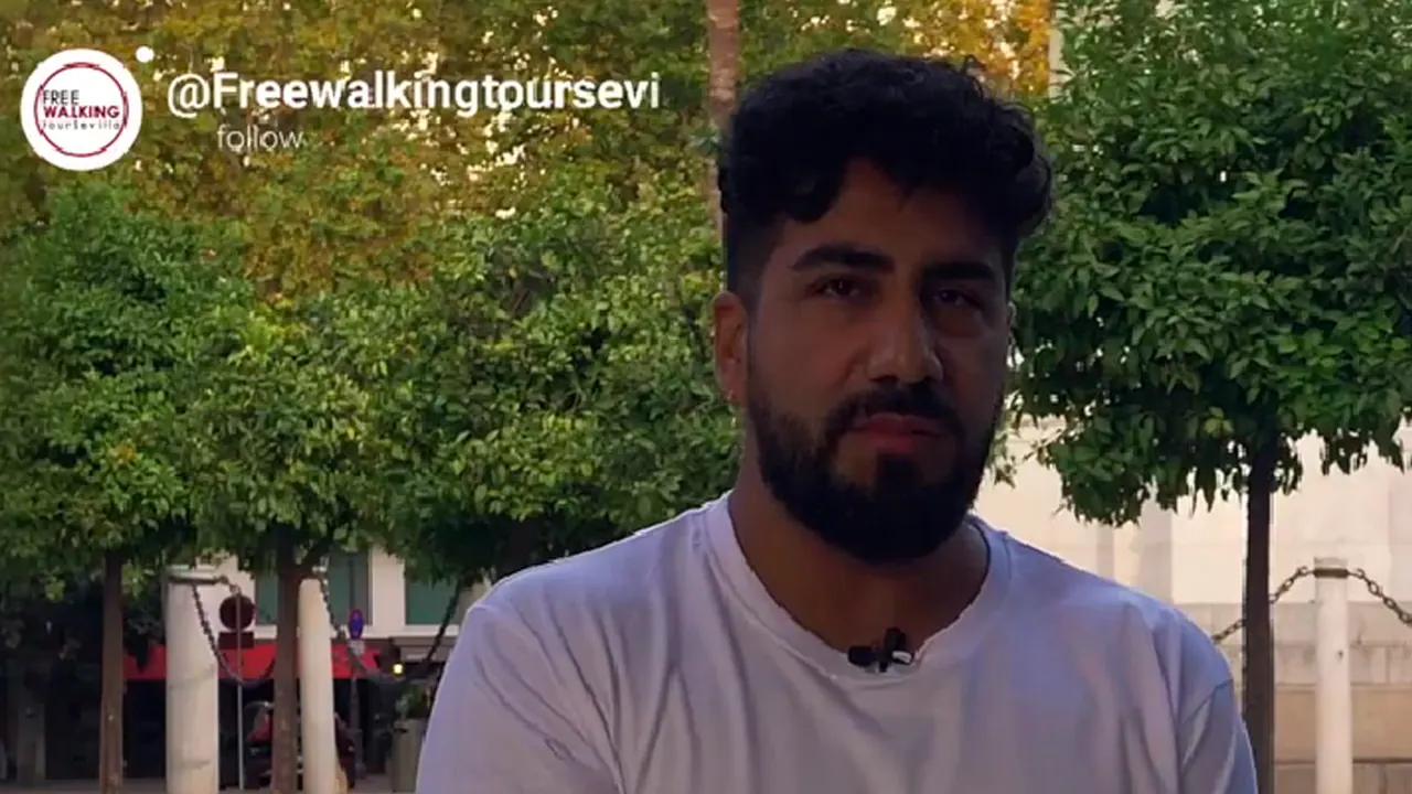 A Free Walking Tour Sevilla guide among orange trees